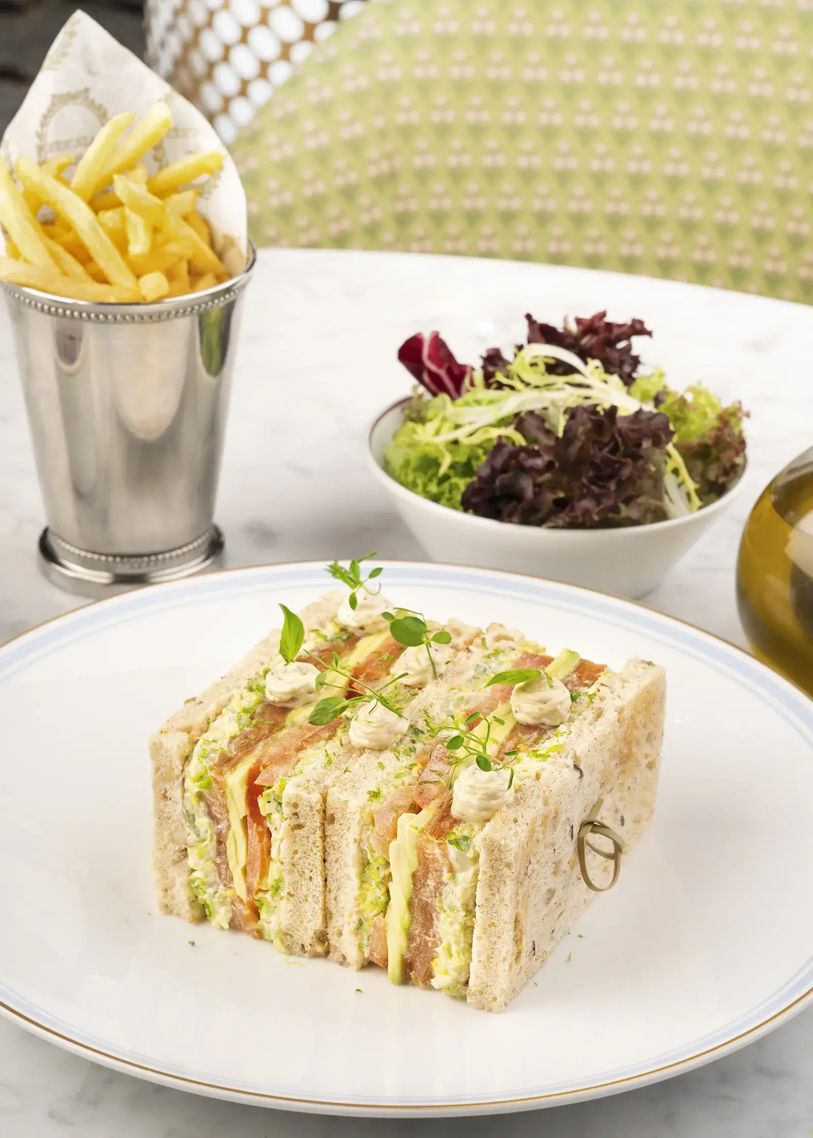 A club sandwich with smoked salmon and cream cheese.