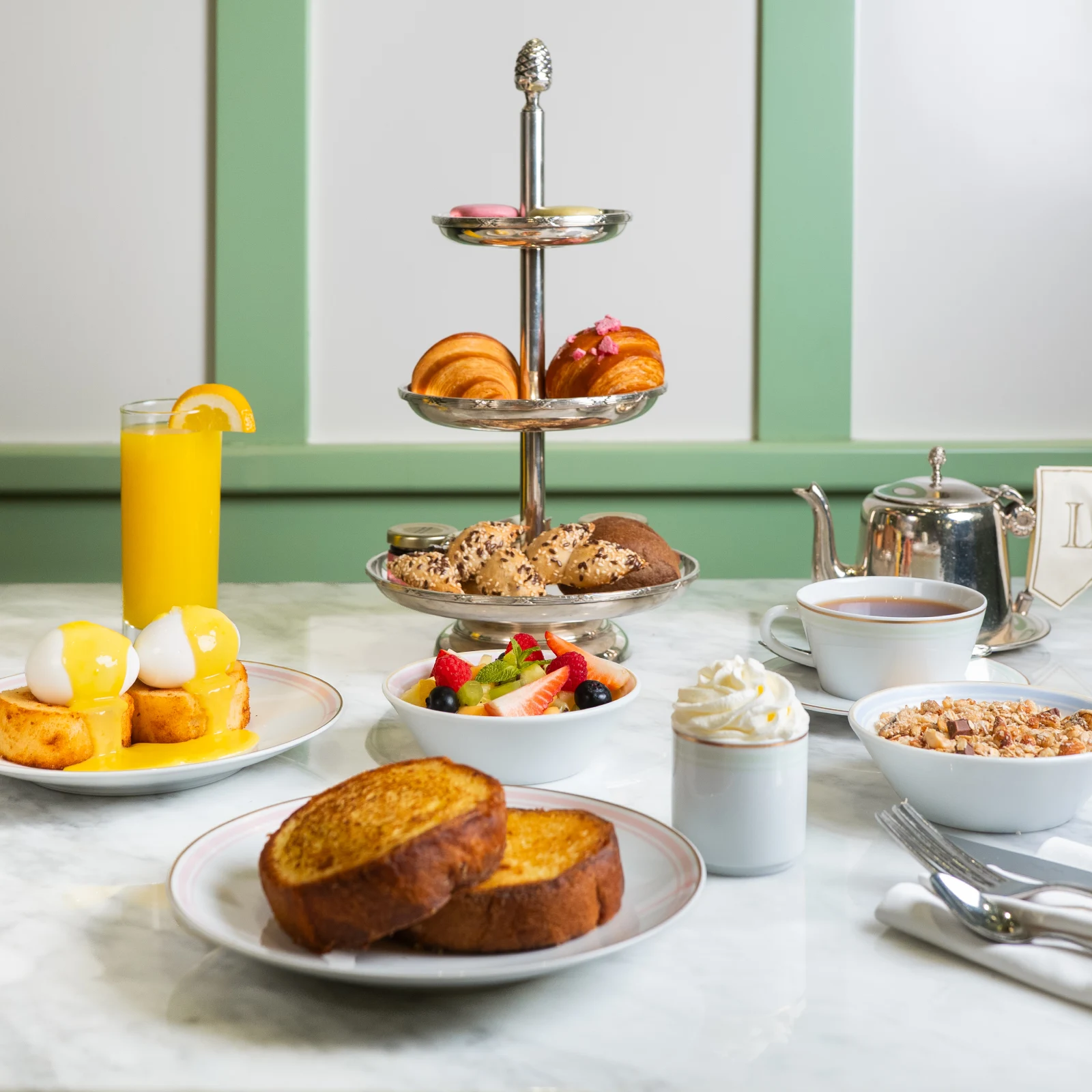 A beautifully arranged table with a variety of brunch dishes.