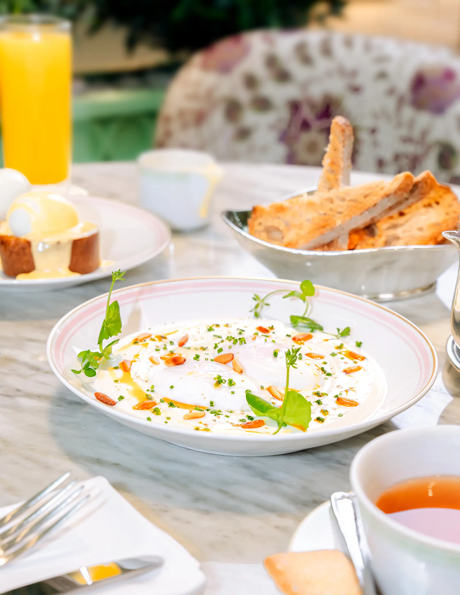 A dish of poached eggs on labneh with chilly oil.