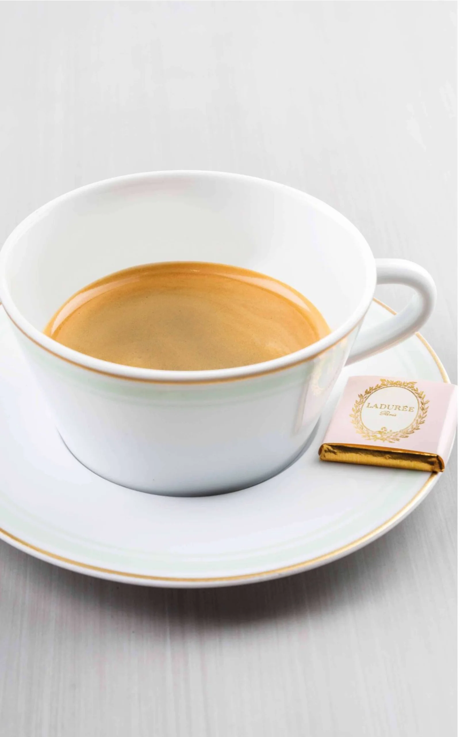 A double shot of espresso in a small cup.