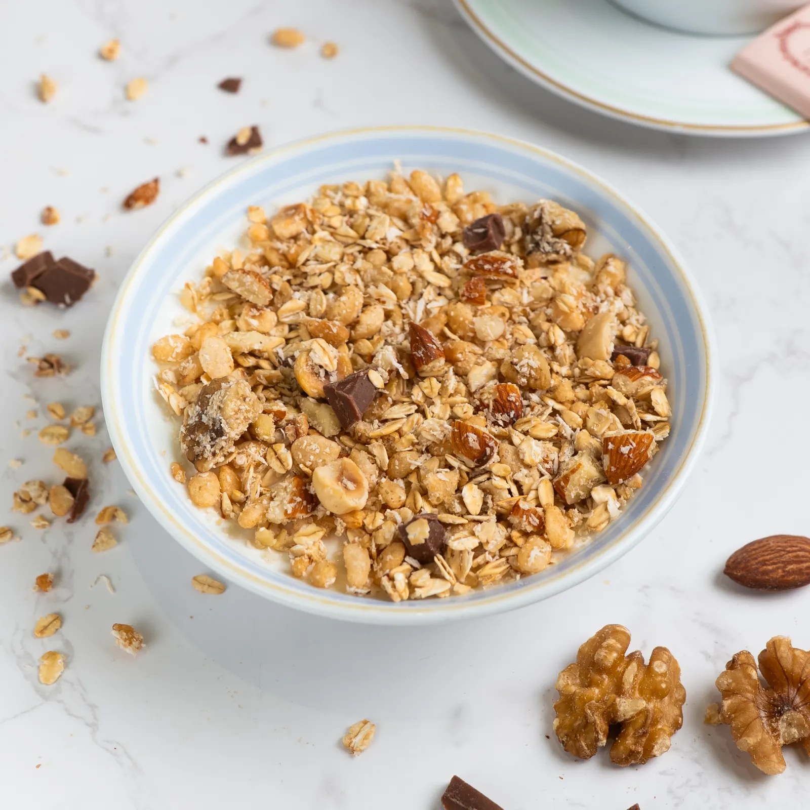 A bowl of yogurt with granola.