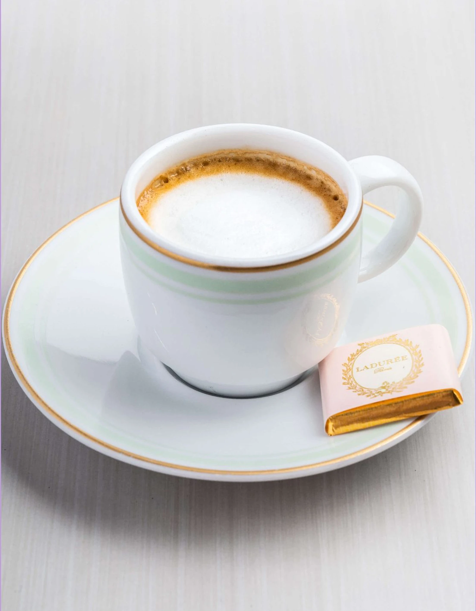 A cup of espresso mixed with milk.